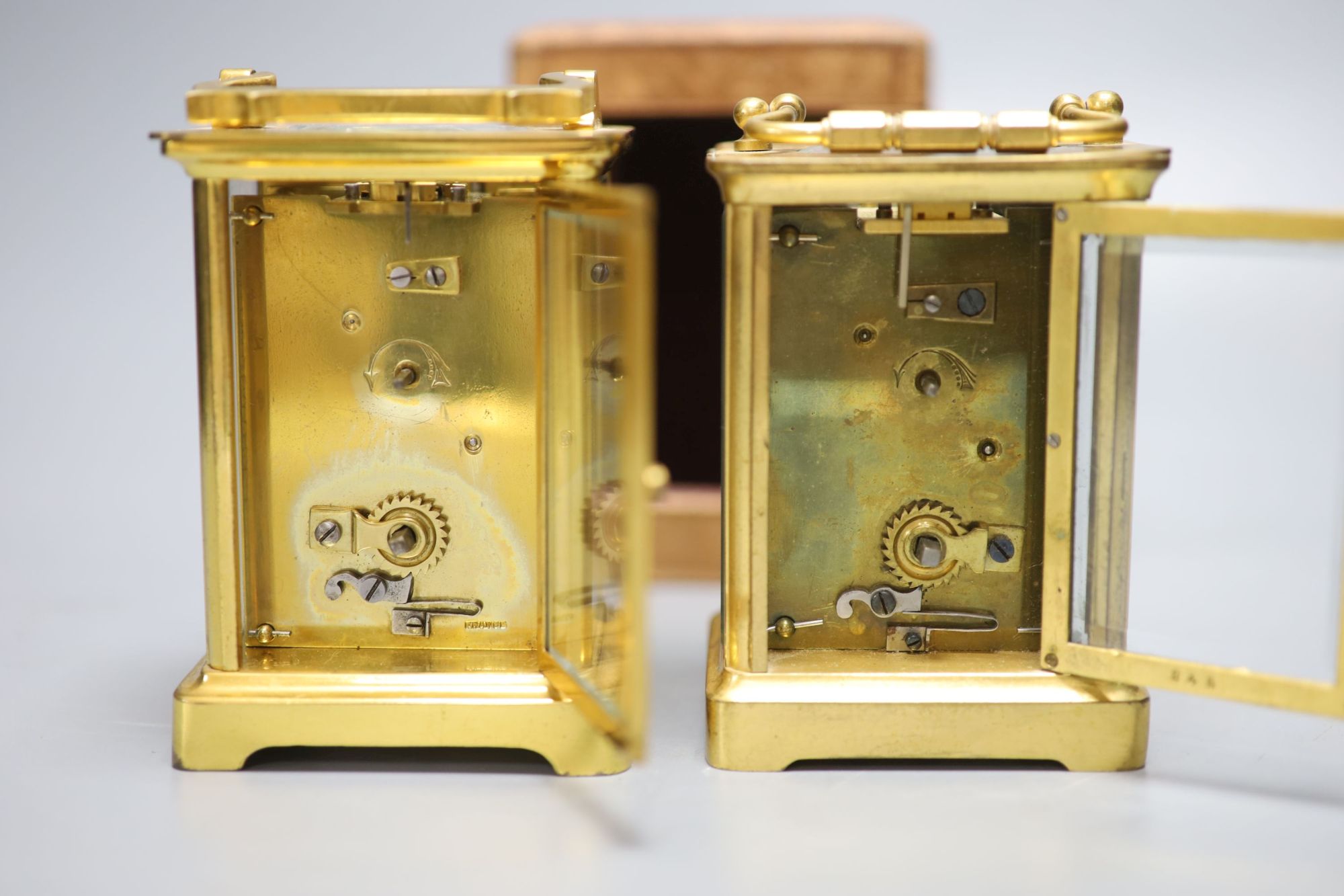 Two French gilt brass carriage timepieces, one cased